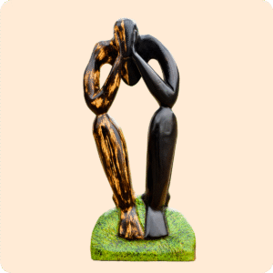 A Carved Sculpture Of A Thinking Man