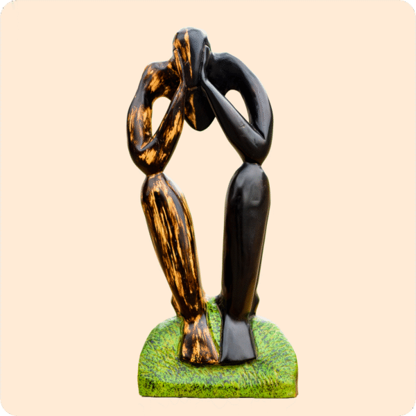 A Carved Sculpture Of A Thinking Man