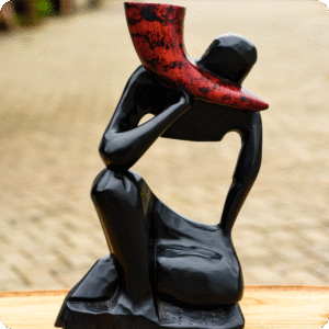 A Horn Blower Carved Scuplture